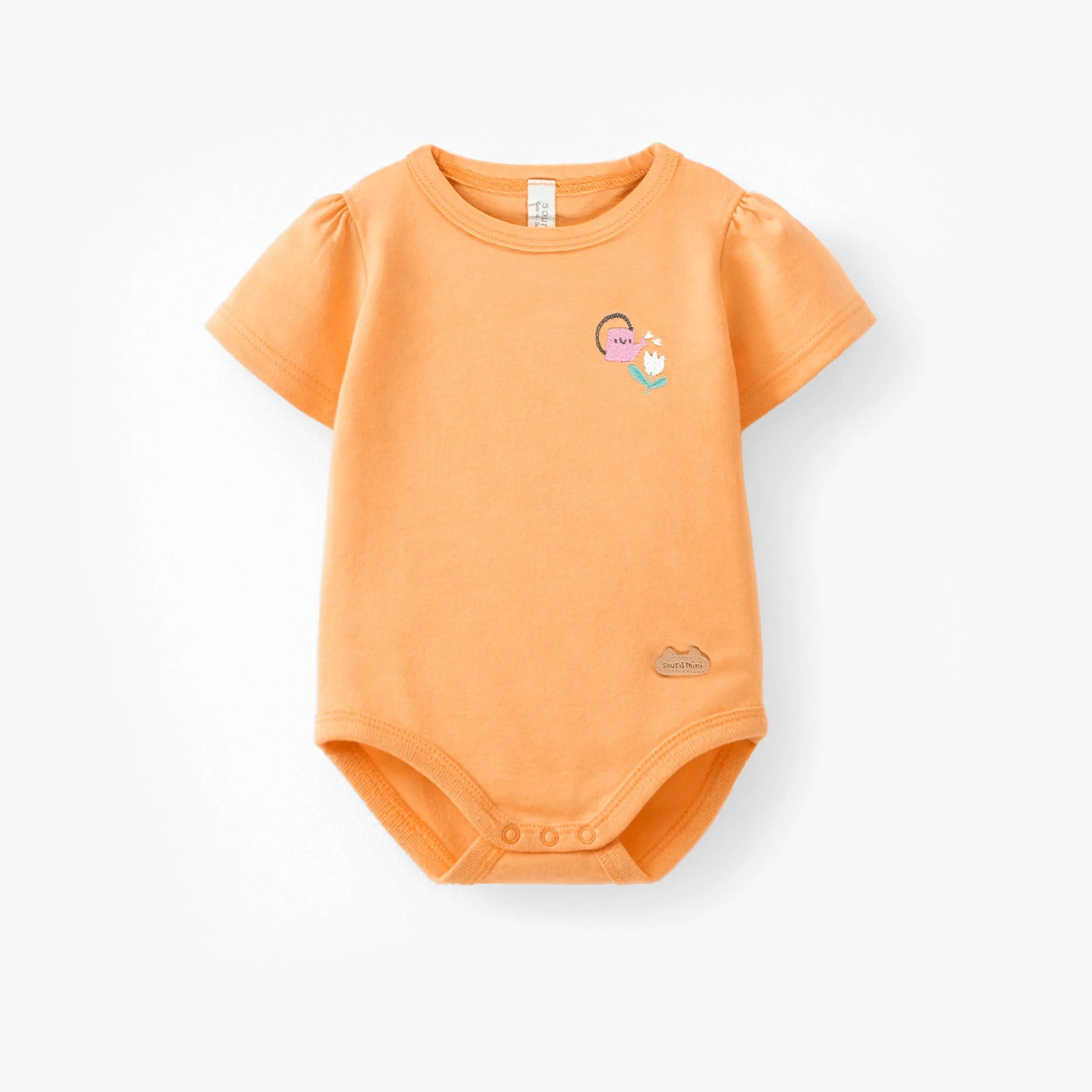 Cache-couche orange avec illustration, naissance