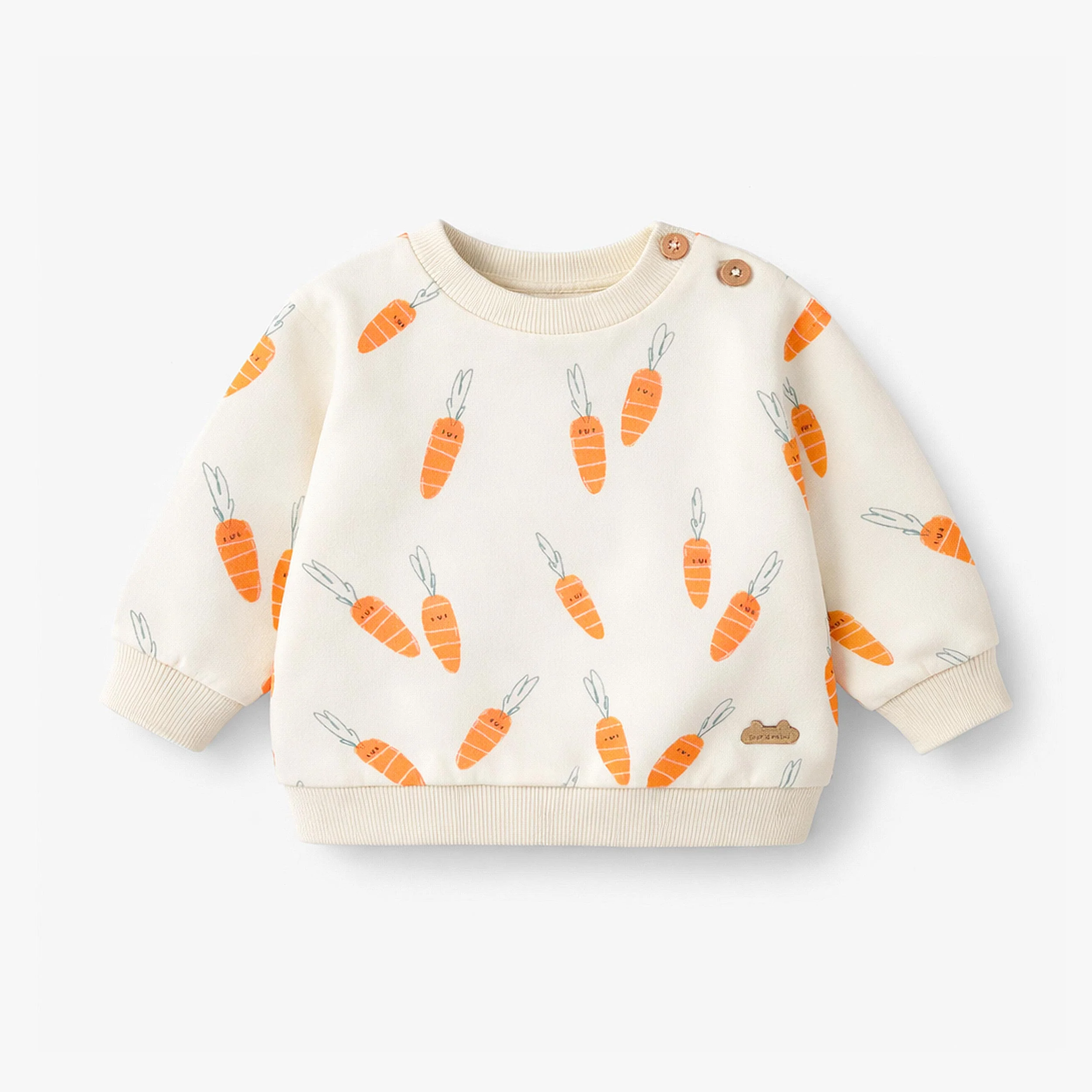 Chandail crème à motifs de carottes, naissance