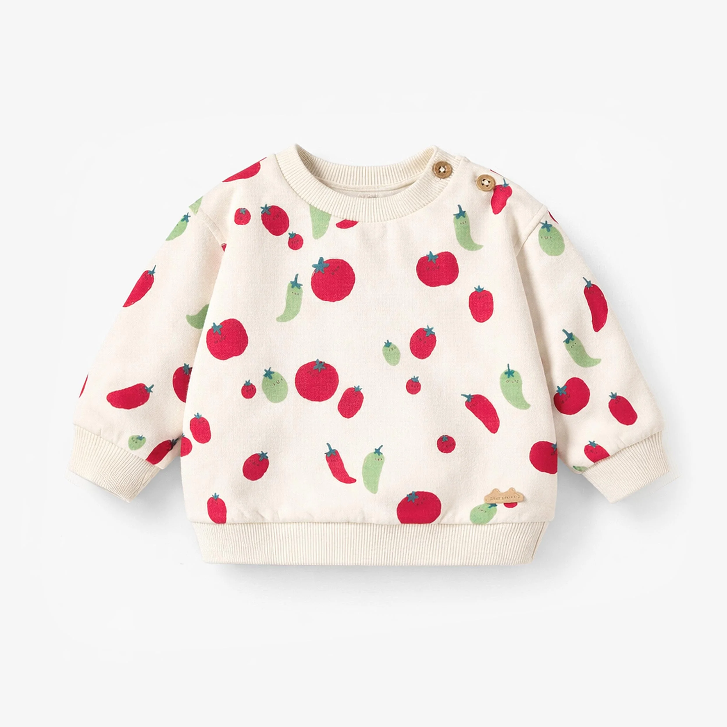 Chandail crème à motifs de tomates et piments, naissance