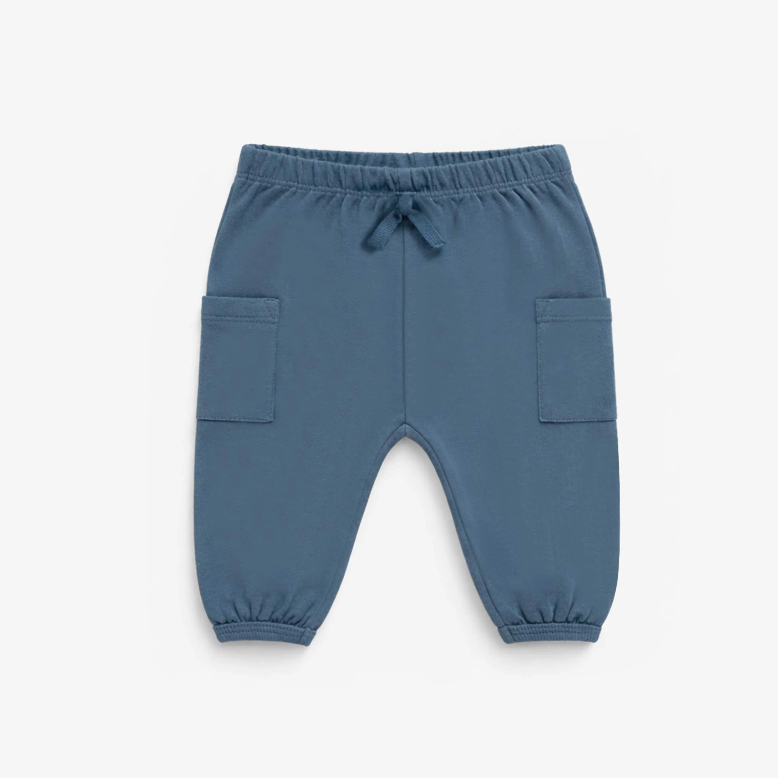 Pantalon bleu style jogger, naissance
