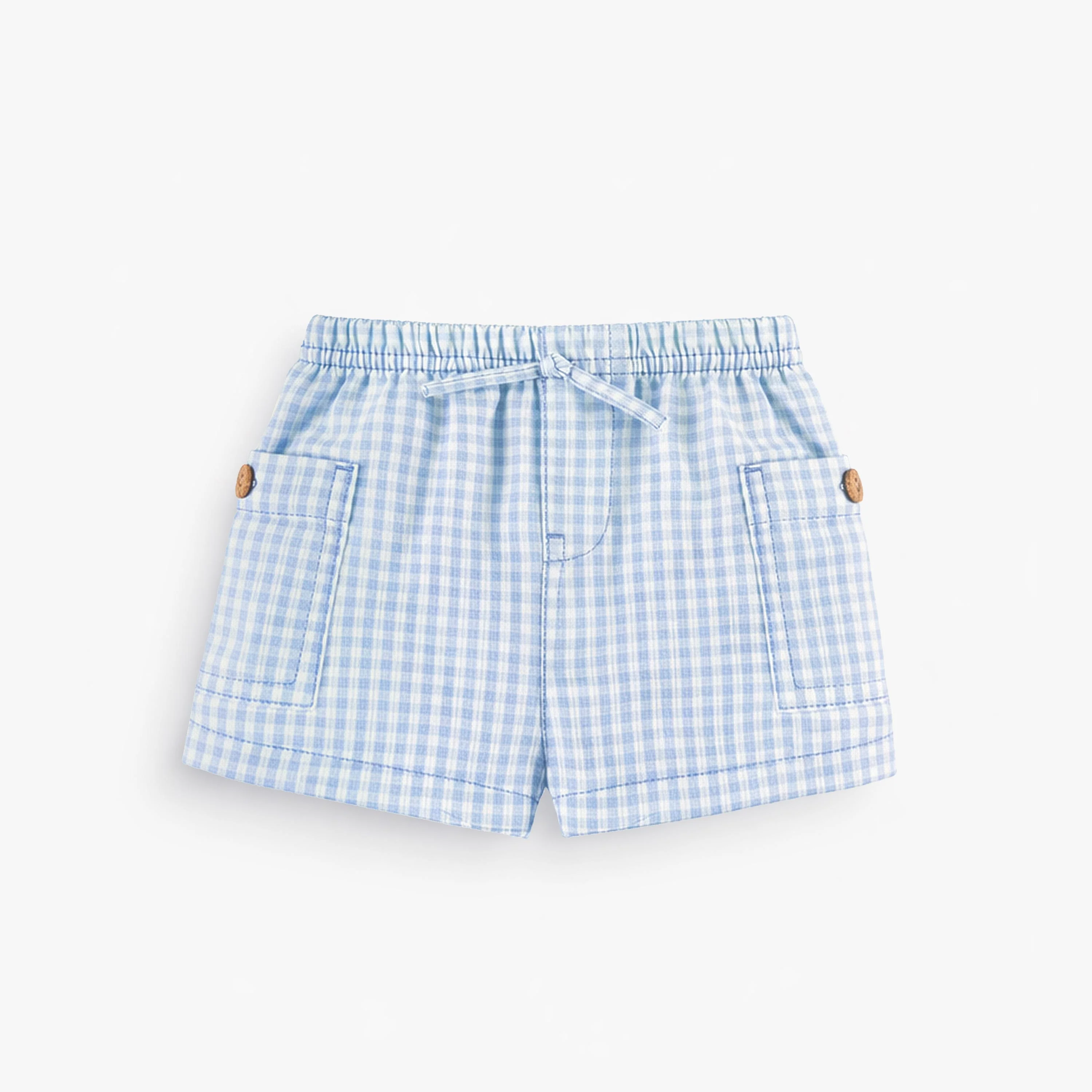 Short bleu pâle à carreaux, naissance